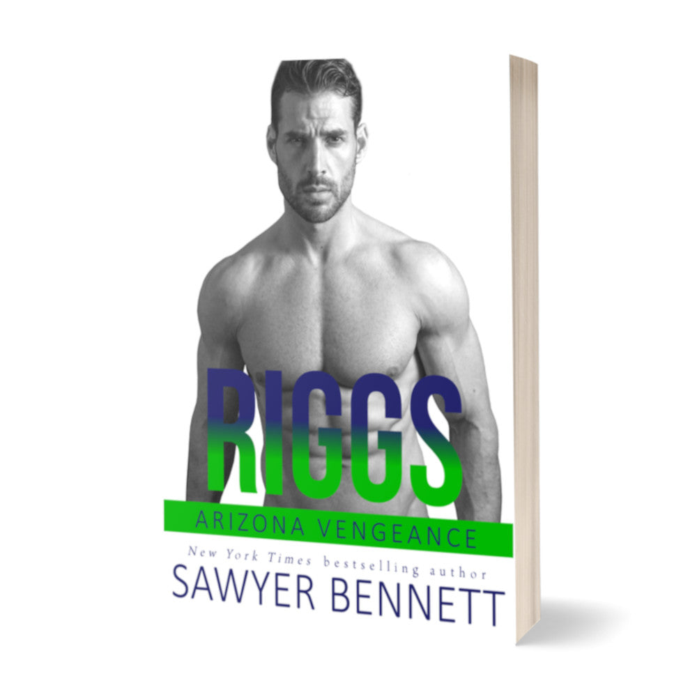 Hockey romance paperback featuring an attractive shirtless man with dark hair and dark beard, arms hanging at his sides. The title of the book is Riggs by New York Times Bestselling Author Sawyer Bennett.