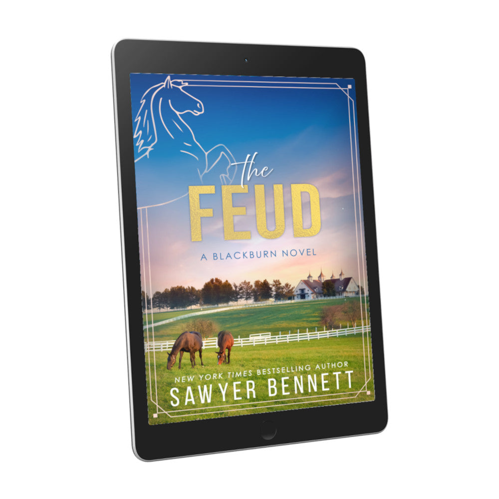 Contemporary romance book cover featuring a white horse barn on the green, rolling hills of Kentucky at sunset displayed on an e-reader. The title of the book is The Feud by New York Times Bestselling Author Sawyer Bennett.