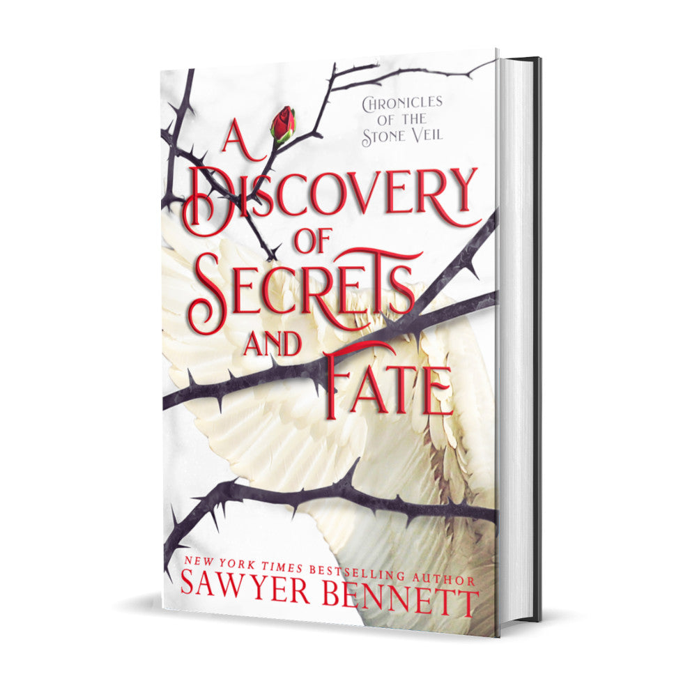Fantasy romance hardcover with thorned branches sprawled across a white background with white angel wings. The title of the book is A Discovery of Secrets and Fate by New York Times Bestselling Author Sawyer Bennett.