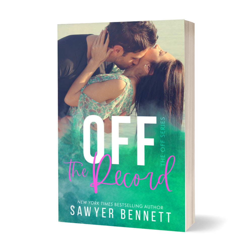 Contemporary romance paperback featuring an attractive couple in their mid-20’s embracing. The title of the book is Off the Record by New York Times Bestselling Author Sawyer Bennett.