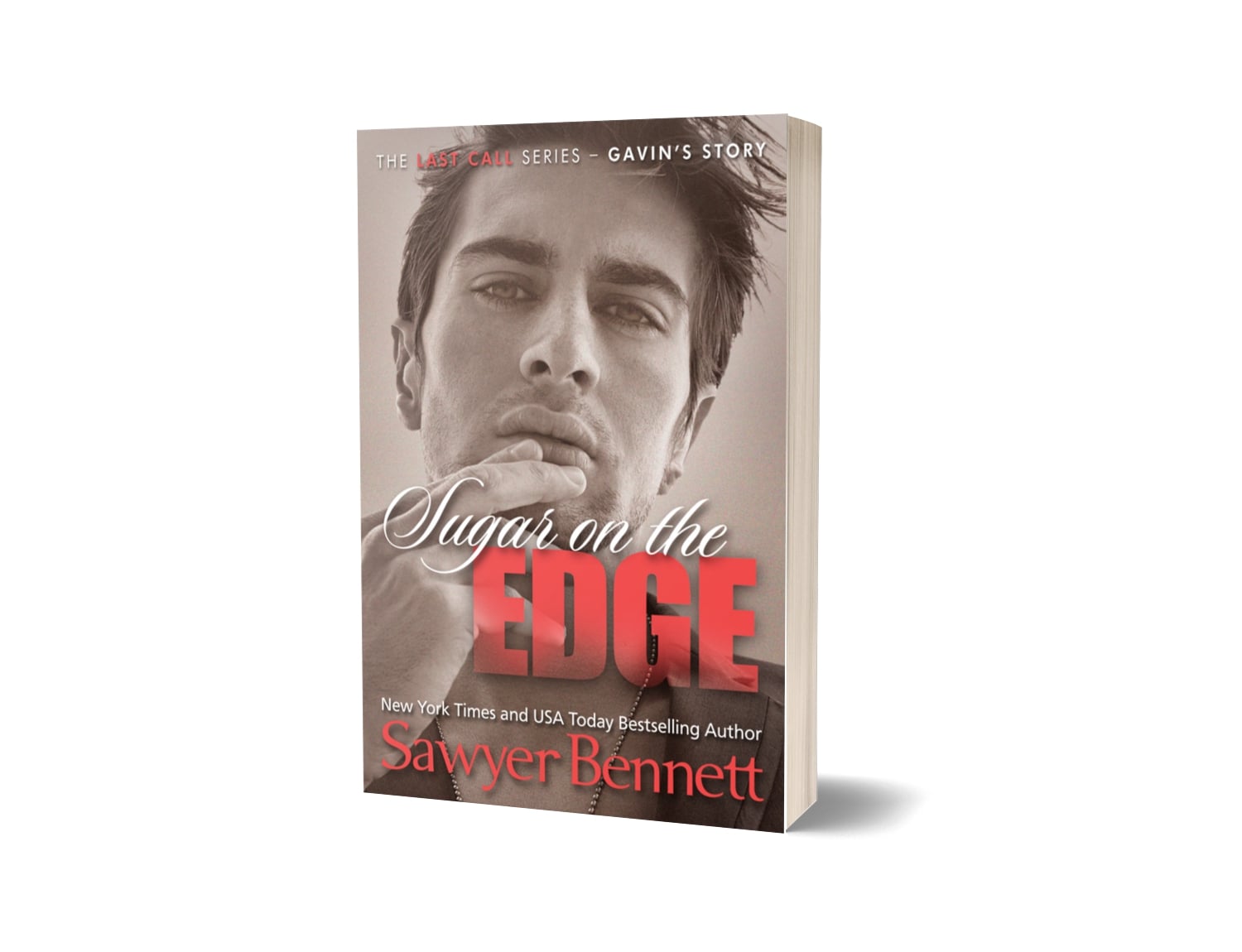 Contemporary romance paperback featuring an attractive man in his early to mid-20’s. The title of the book is Sugar on the Edge by New York Times Bestselling Author Sawyer Bennett.