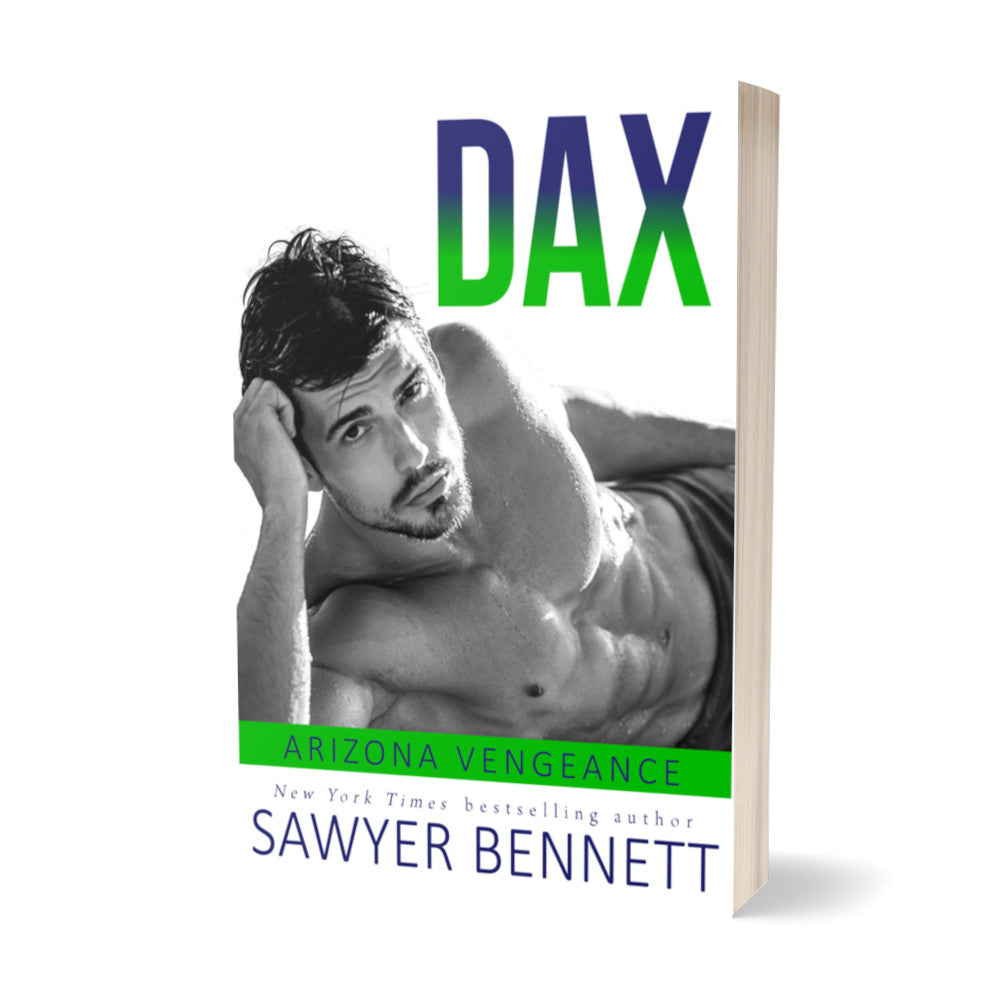 Hockey romance paperback featuring an attractive man in his mid-20’s lying on his side with one hand on his head, shirtless, with short, dark hair and dark eyes. The title of the book is Dax by New York Times Bestselling Author Sawyer Bennett.