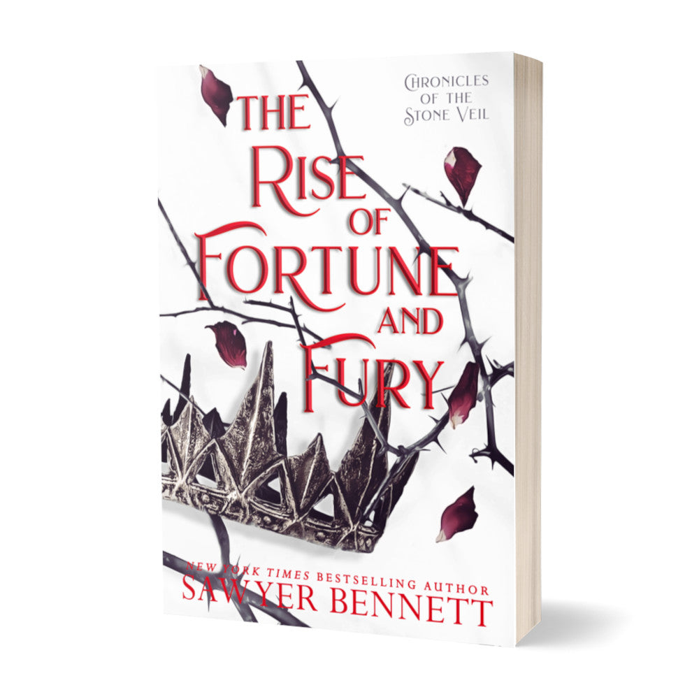 Fantasy romance paperback with thorned branches sprawled across a white background and dark colored crown with falling rose petals. The title of the book is The Rise of Fortune and Fury by New York Times Bestselling Author Sawyer Bennett.