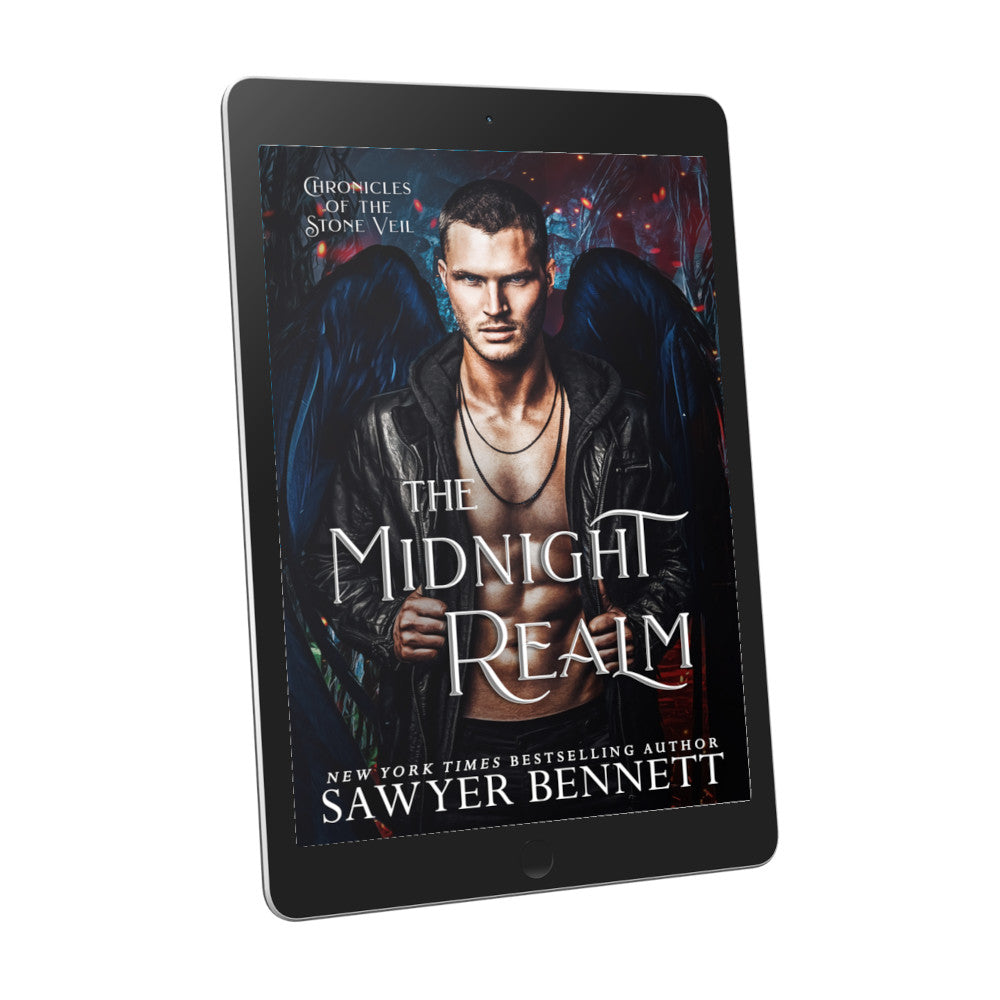 Fantasy romance book cover with dark background with spots of fire and ash and an attractive man with black angel wings wearing a black leather jacket open to reveal a bare chest, displayed on an e-reader. The title of the book is The Midnight Realm by New York Times Bestselling Author Sawyer Bennett.