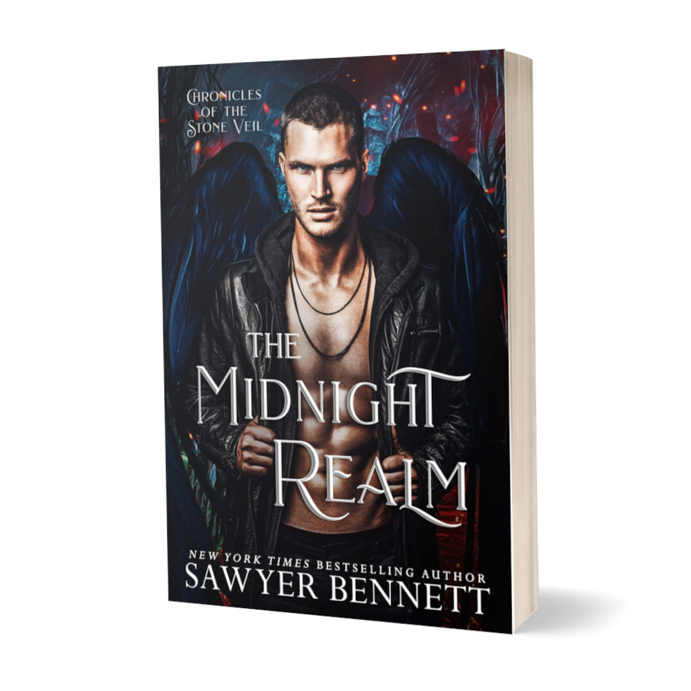 Fantasy romance paperback with dark background with spots of fire and ash and an attractive man with black angel wings wearing a black leather jacket open to reveal a bare chest. The title of the book is The Midnight Realm by New York Times Bestselling Author Sawyer Bennett.