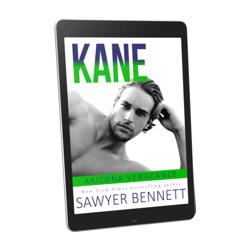 Hockey romance book cover featuring an attractive shirtless man laying on his side, with his head resting on one hand, displayed on an e-reader. The title of the book is Kane by New York Times Bestselling Author Sawyer Bennett.