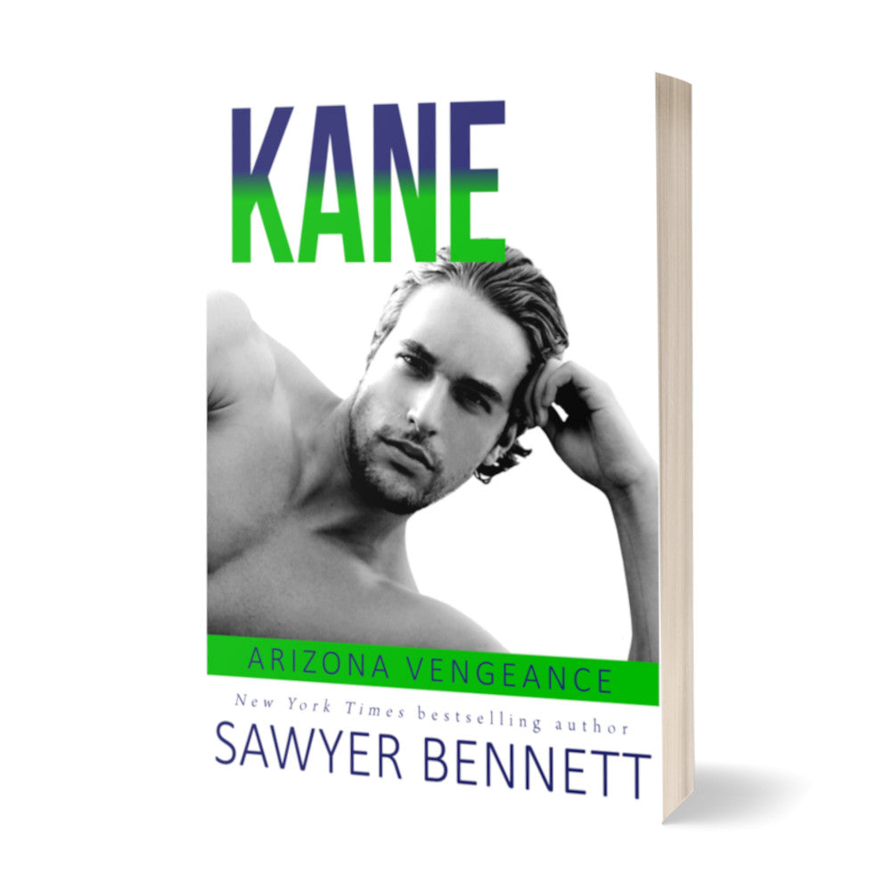 Hockey romance paperback featuring an attractive shirtless man laying on his side, with his head resting on one hand. The title of the book is Kane by New York Times Bestselling Author Sawyer Bennett.