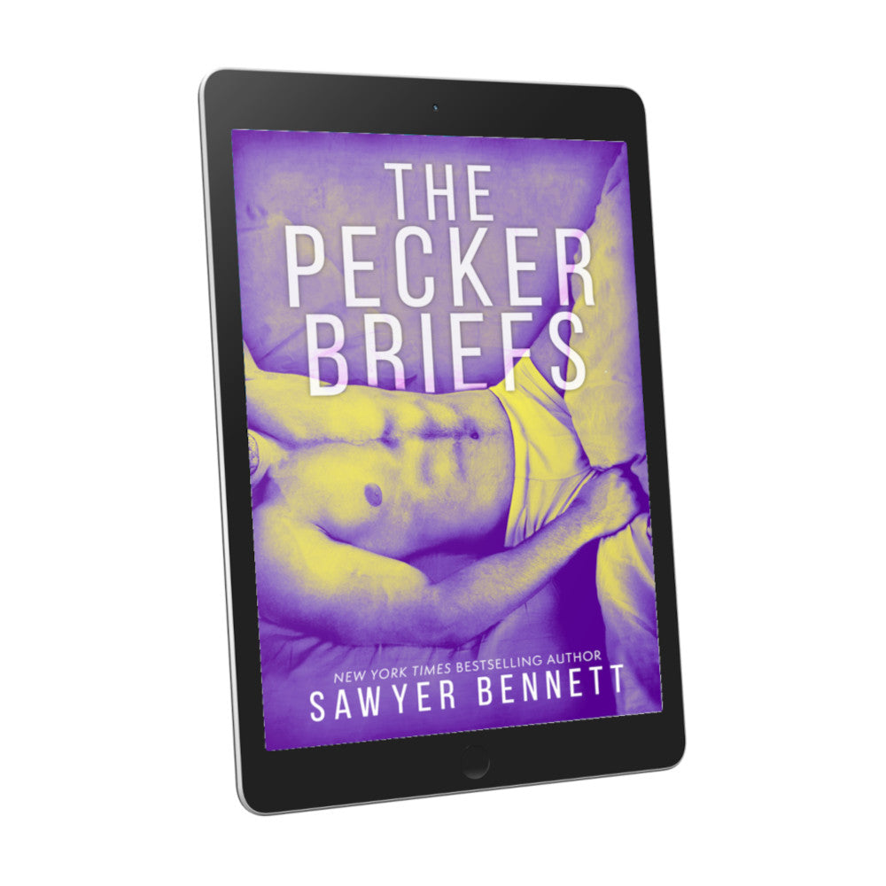 Contemporary romance book cover featuring a shirtless man, shown from the neck to thighs, laying on his back with a purple color treatment on the photo, displayed on an e-reader. The title of the book is The Pecker Briefs by New York Times Bestselling Author Sawyer Bennett.