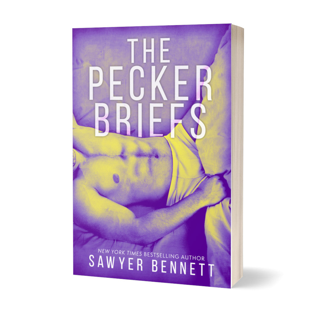 Contemporary romance paperback featuring a shirtless man, shown from the neck to thighs, laying on his back with a purple color treatment on the photo. The title of the book is The Pecker Briefs by New York Times Bestselling Author Sawyer Bennett.