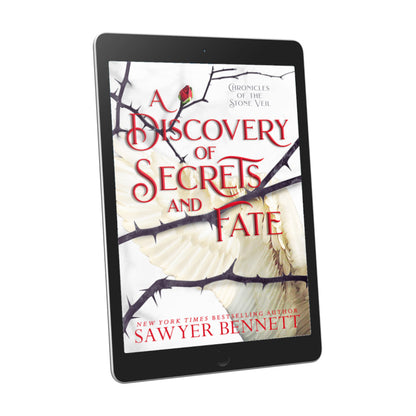 Fantasy romance book cover with thorned branches sprawled across a white background with white angel wings, displayed on an e-reader. The title of the book is A Discovery of Secrets and Fate by New York Times Bestselling Author Sawyer Bennett.