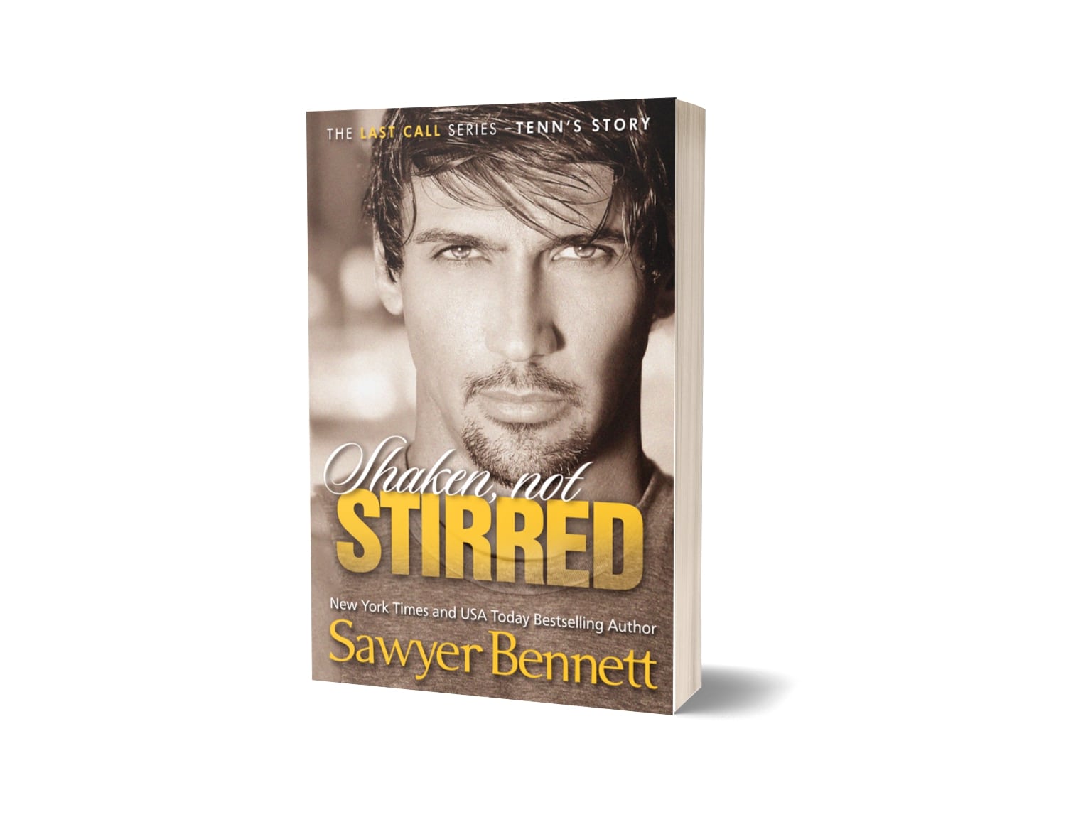 Contemporary romance paperback featuring an attractive man in his early to mid-20’s. The title of the book is Shaken Not Stirred by New York Times Bestselling Author Sawyer Bennett.