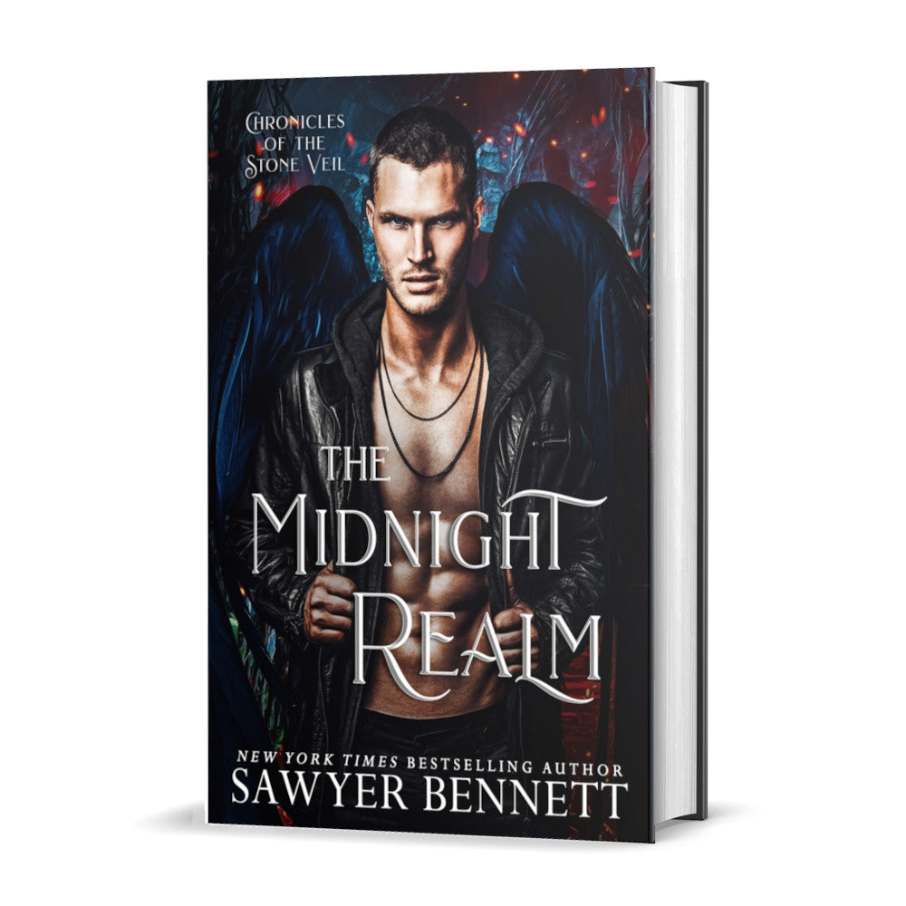 Fantasy romance hardcover with dark background with spots of fire and ash and an attractive man with black angel wings wearing a black leather jacket open to reveal a bare chest. The title of the book is The Midnight Realm by New York Times Bestselling Author Sawyer Bennett.