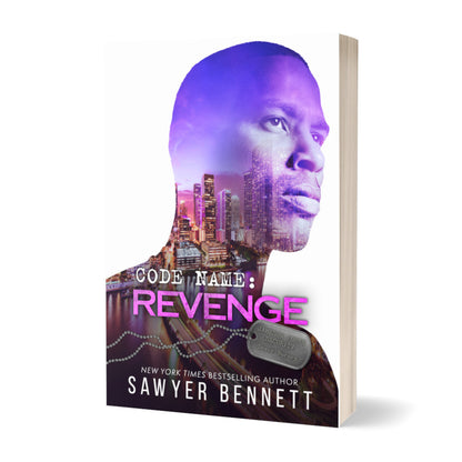 Romantic suspense paperback featuring an attractive man and city scape. The title of the book is Code Name: Revenge by New York Times Bestselling Author Sawyer Bennett.